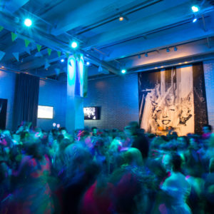 A group of teens dancing at the Warhol Museum lobby