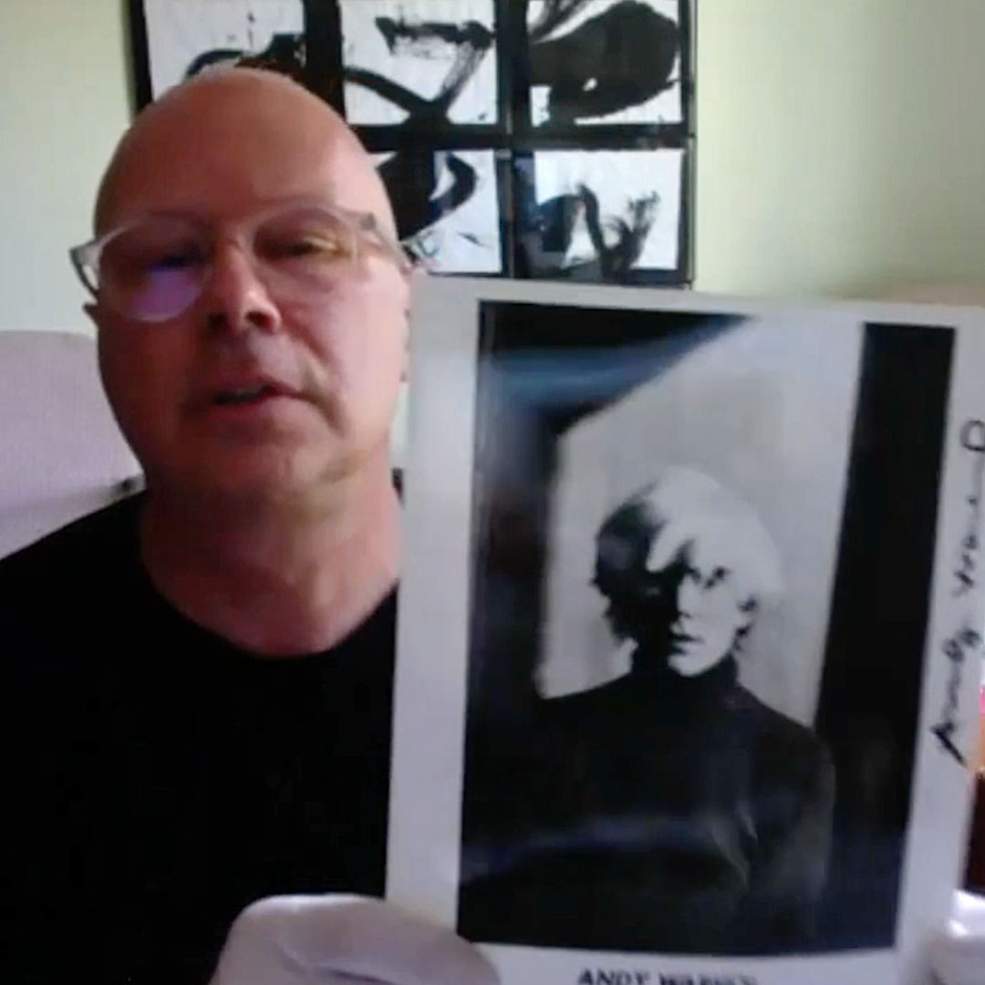 Donald Warhola holding a photo of Andy Warhol