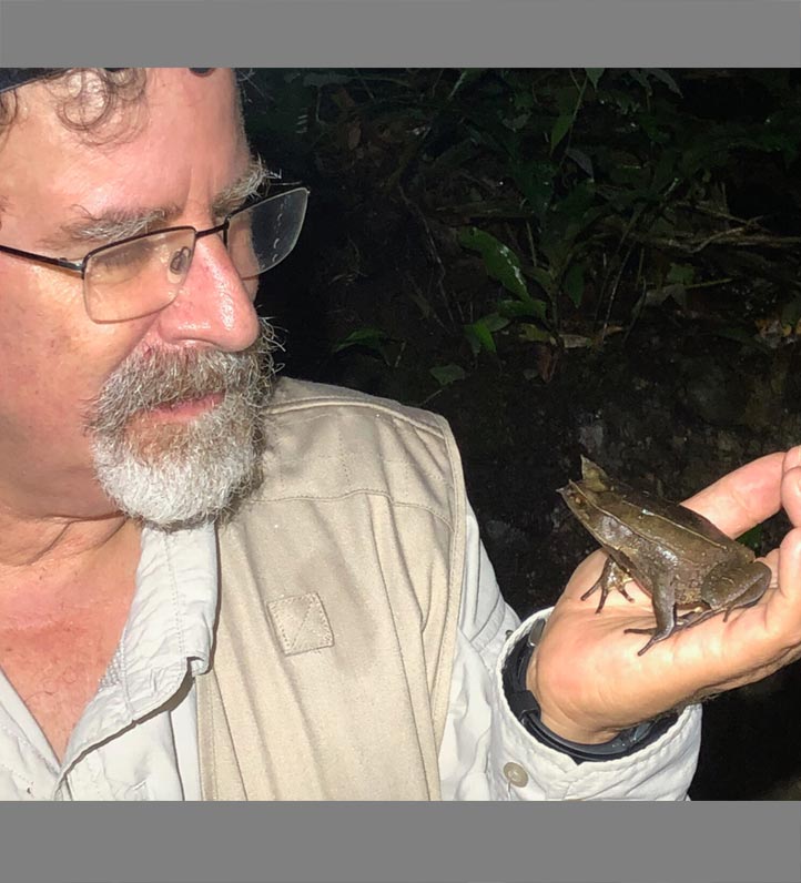 Dr. Rafael Marquez, Senior Researcher, Museo Nacional Ciencias Naturales holding a frog.