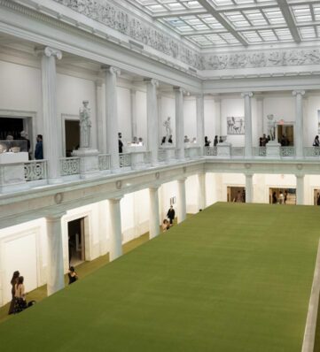 The Hall of sculpture with a large green table and floor
