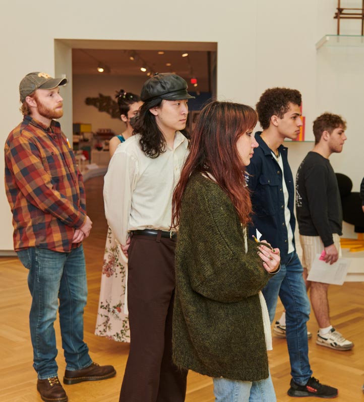 a group of young people in a museum.