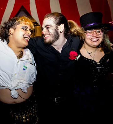 three people in makeup and costumes