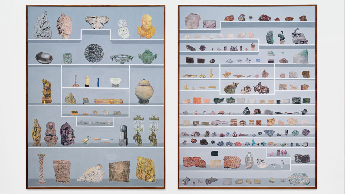 A detailed arrangement of various artifacts and minerals displayed on a light blue background, showcasing their diverse shapes and colors.