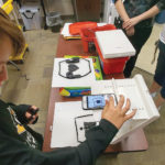 a child using a tactile-assisted device