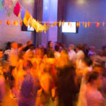 A colorful photo of teens at the Wahol Museum' LGBTQ Youth Prom