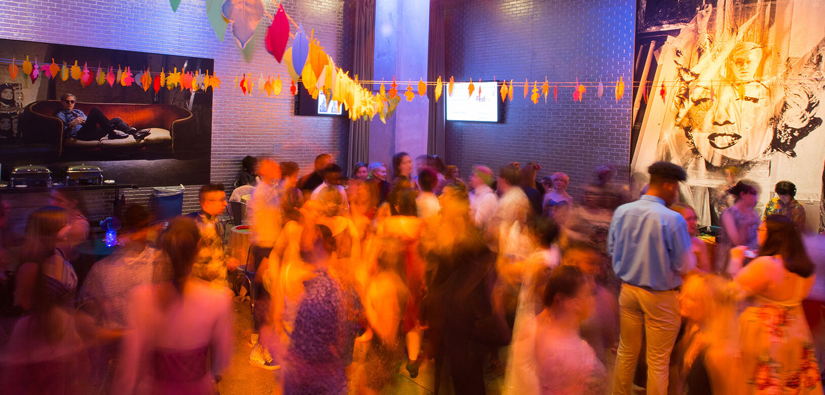 A colorful photo of teens at the Wahol Museum' LGBTQ Youth Prom