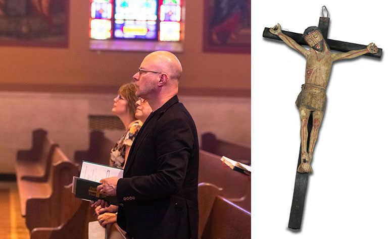 People attending a church service. A handmade crucifix.