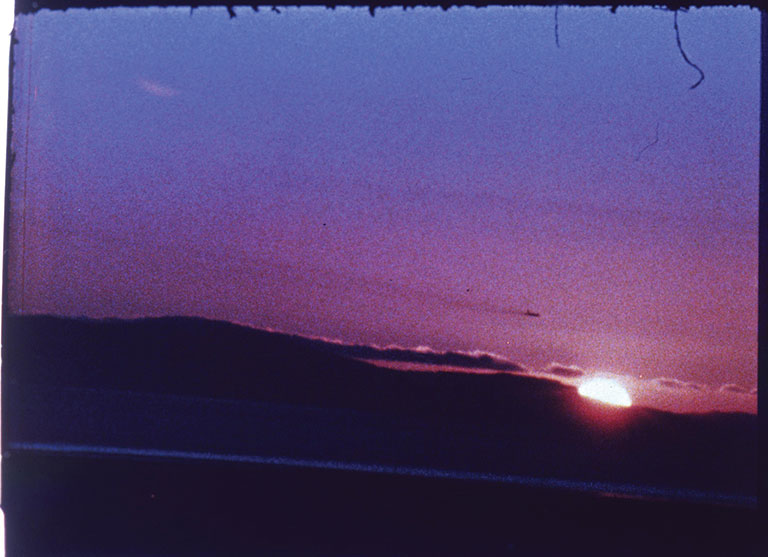 A still from a movie showing a sunset