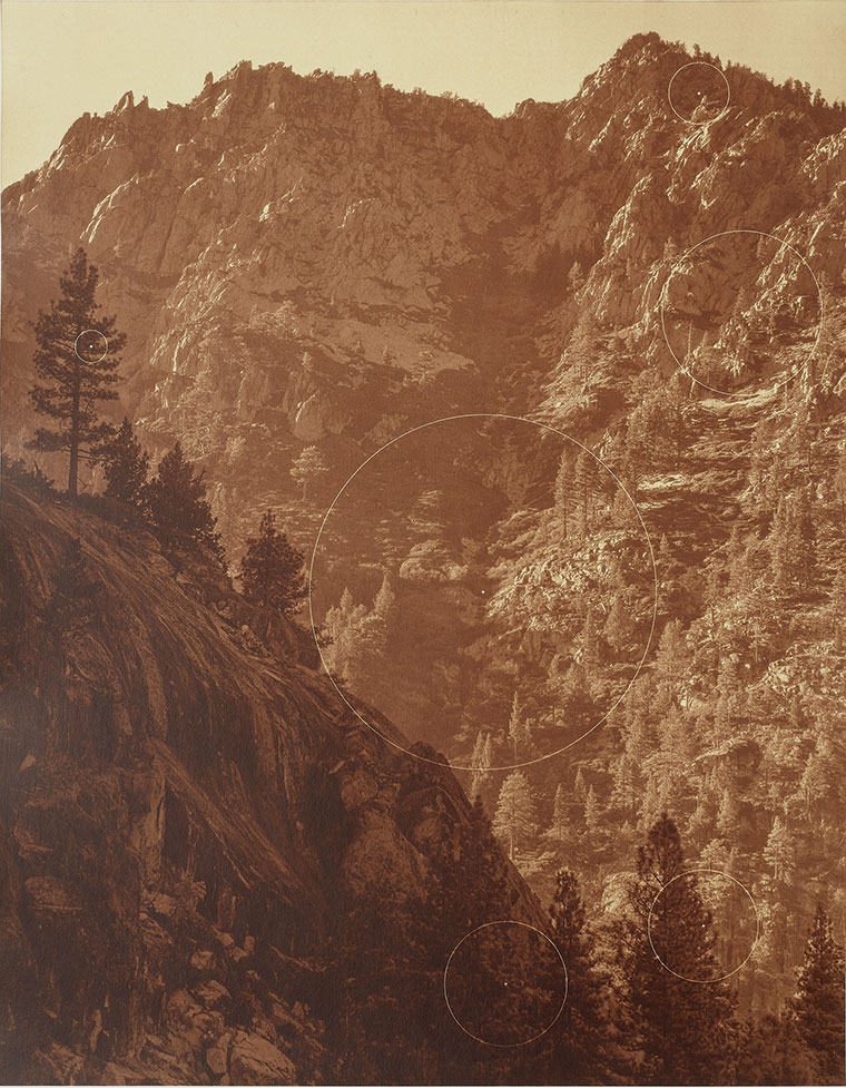 A sepia toned photo of mountains with geometric shapes superimposed onto it.