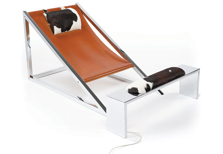 A lounge chair with leather and cow hide