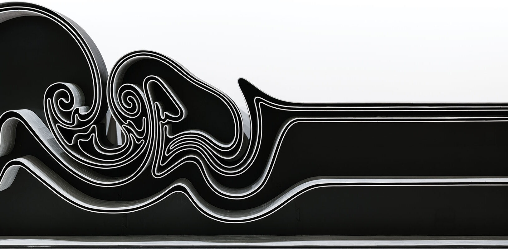 A black and silver abstract-shaped bookcase