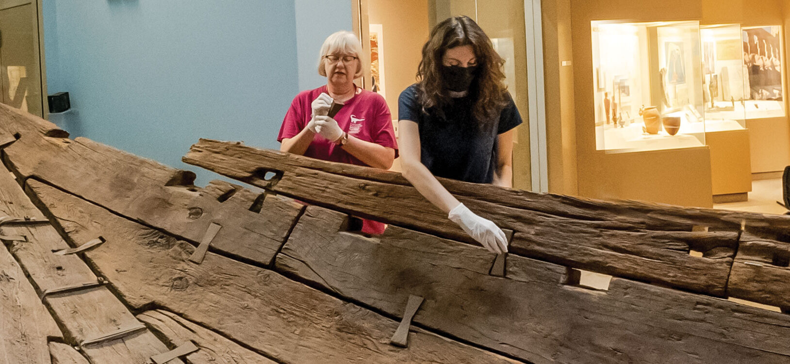 2 women working on an ancient egyptian boat