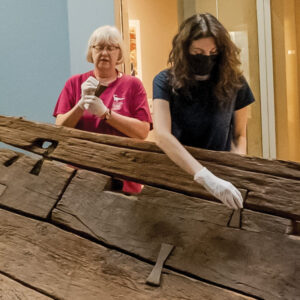 2 women working on an ancient egyptian boat
