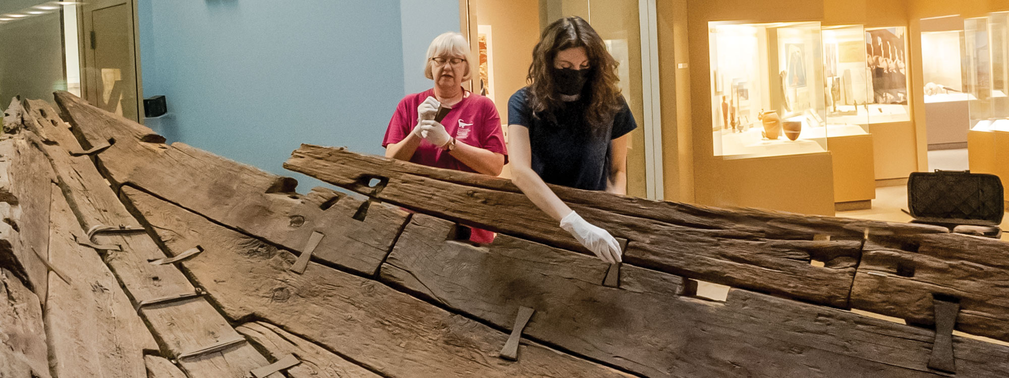 2 women working on an ancient egyptian boat