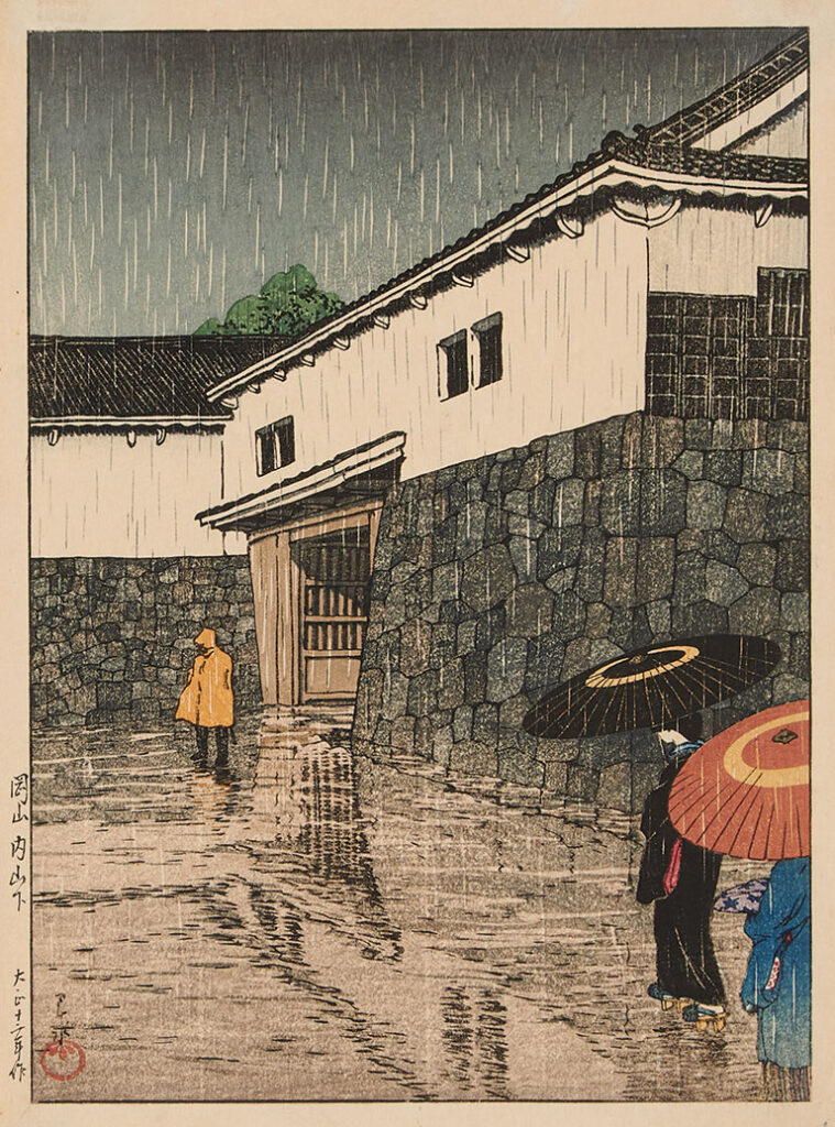A Japanese print showing a rainy scene outside of a building with two people holding umbrellas and another wearing a yellow raincoat.