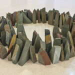 A circular formation made from earth-tone colored stones.