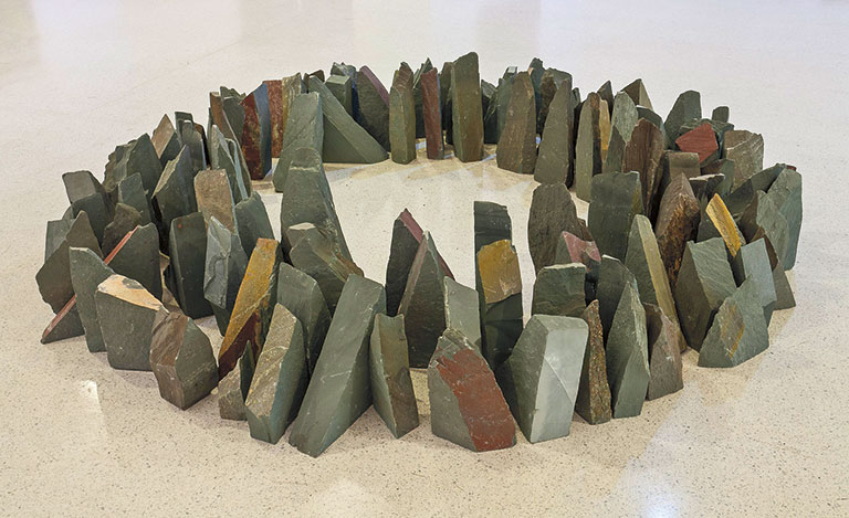 A circular formation made from earth-tone colored stones.