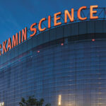 An exterior view of the science center building with the new Kamin Science Center letters around the top of the building.