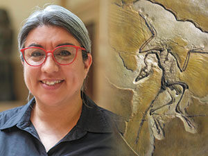 A woman next to a photo of a fossil.