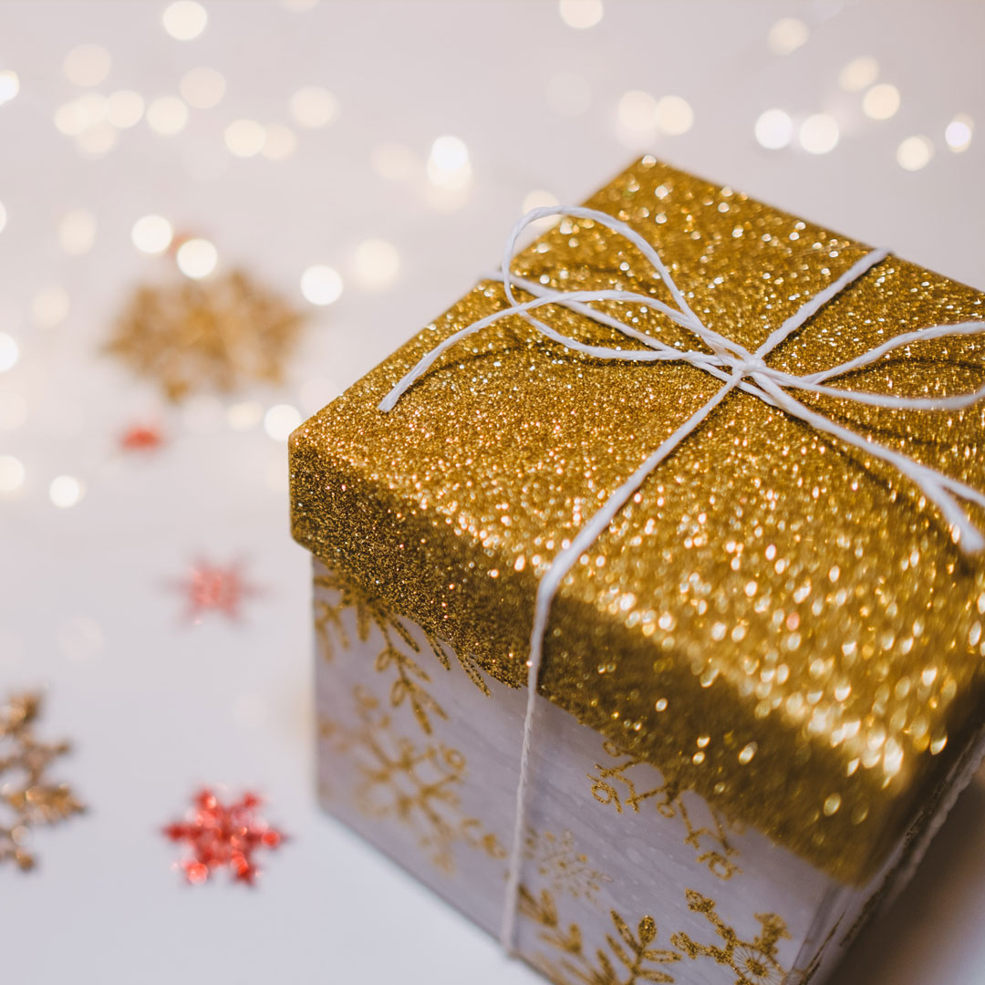 A small gift with a glittery gold top