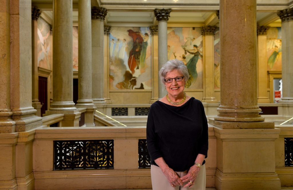 A museum donor standing in the Grand Staircase of the museum