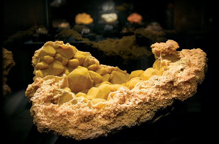 Large yellow mineral specimen.