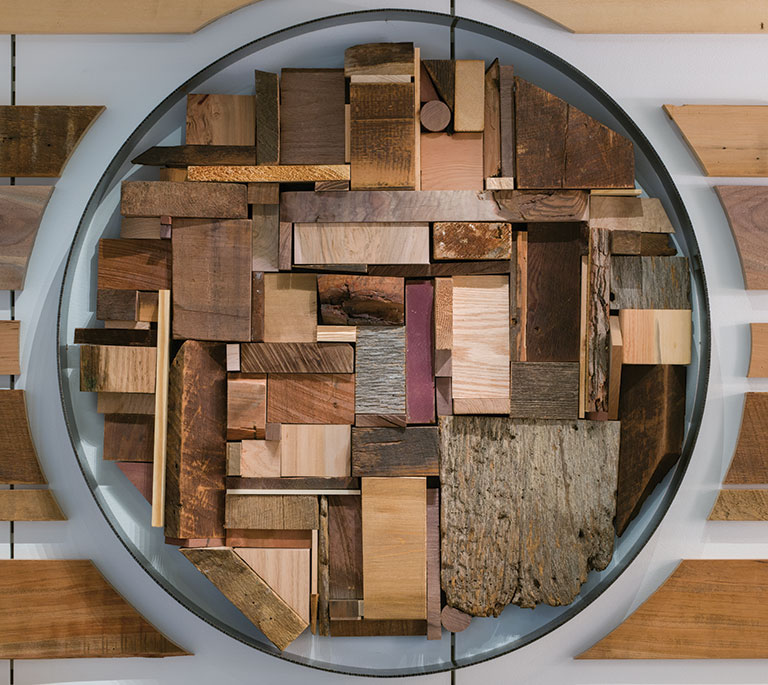 A detail of a sculpture made of reclaimed wood.
