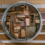 A detail of a sculpture made of reclaimed wood.