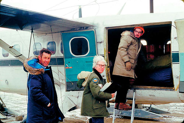 Mary Dawson boarding a plan in the arctic