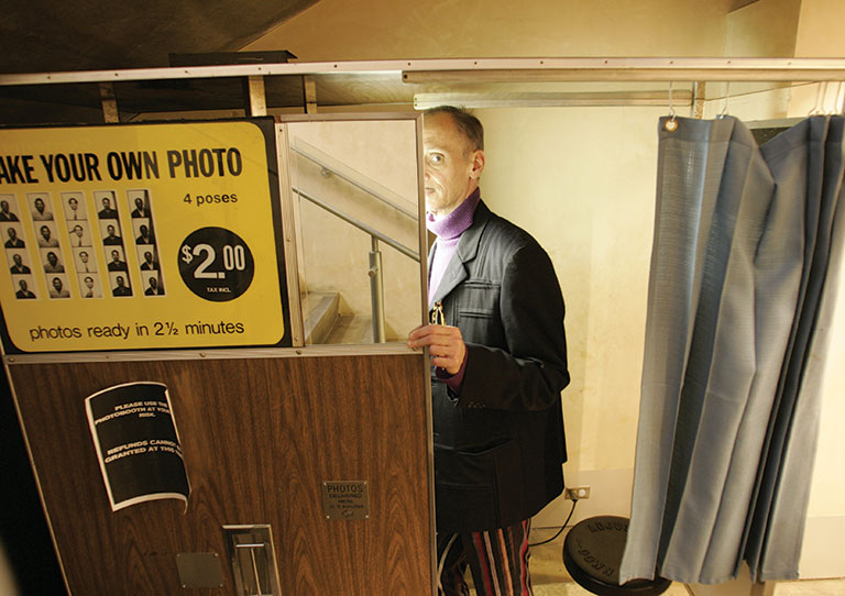 John Waters in a photo booth