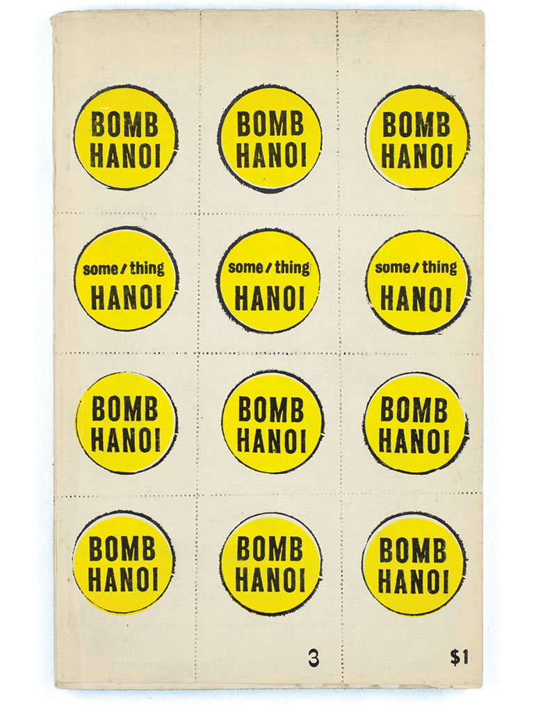 A series of yellow stickers that read, Bomb Hanoi.