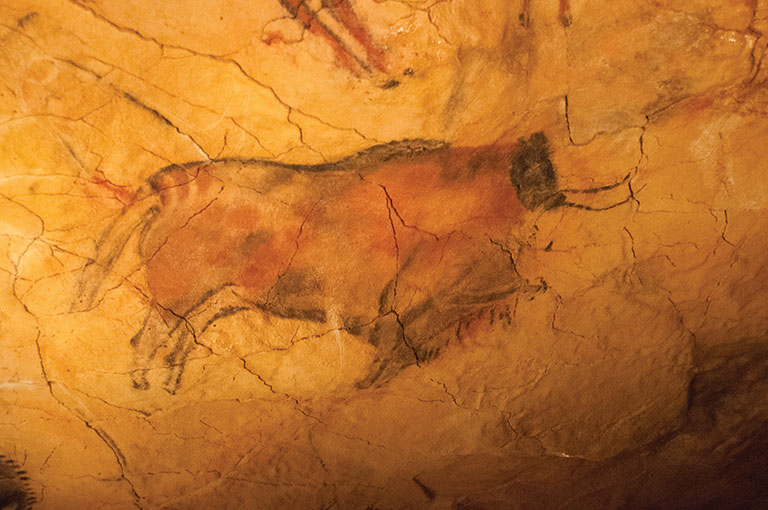 A primitive cave drawing of a cow
