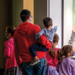 A family walking though a quiet museum gallery