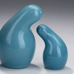 A set of blue organic shaped salt and pepper shakers