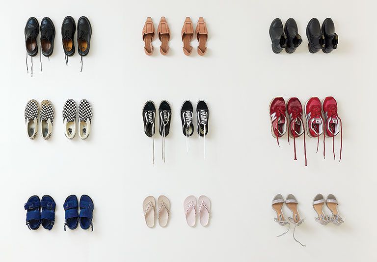 An installation of multiple pairs of shoes