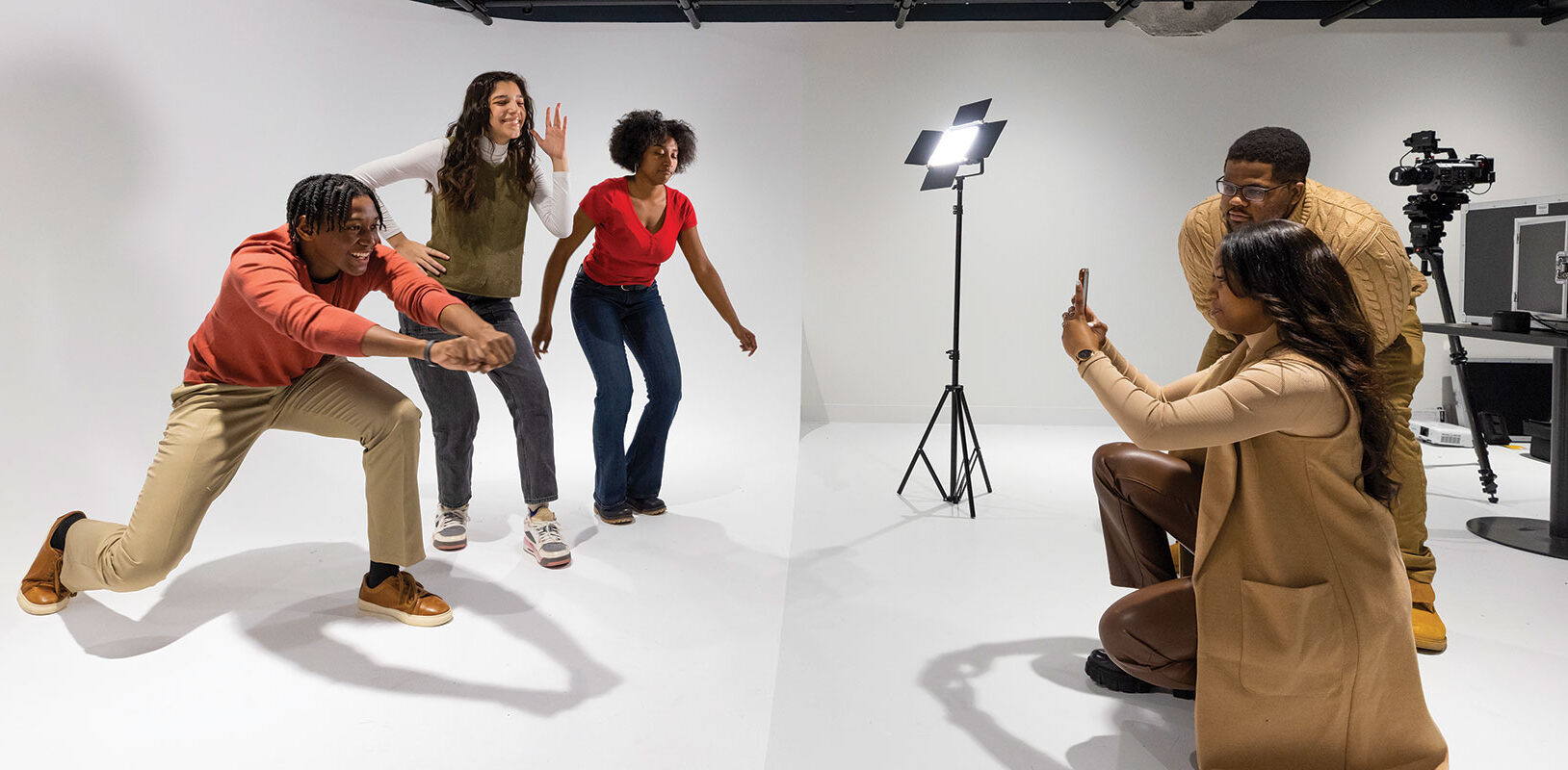 A group of teens posing for a tik-tok video