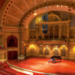 A panoramic beautiful photo of the Carnegie Music Hall.