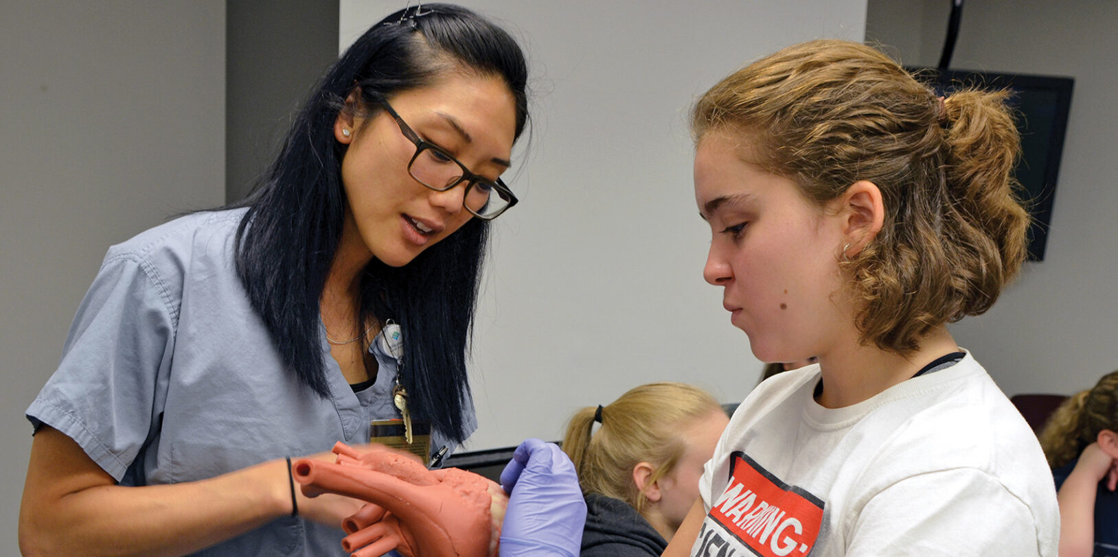 Tour Your Future participant Dallas Mercurio gets an up-close look at a model of a human heart during an interactive tour at Allegheny General Hospital.