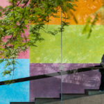 Custodian J.W. Williams, who has worked at Carnegie Museums for 38 years, sanitizes the handrail leading up to the Scaife Galleries at Carnegie Museum of Art.