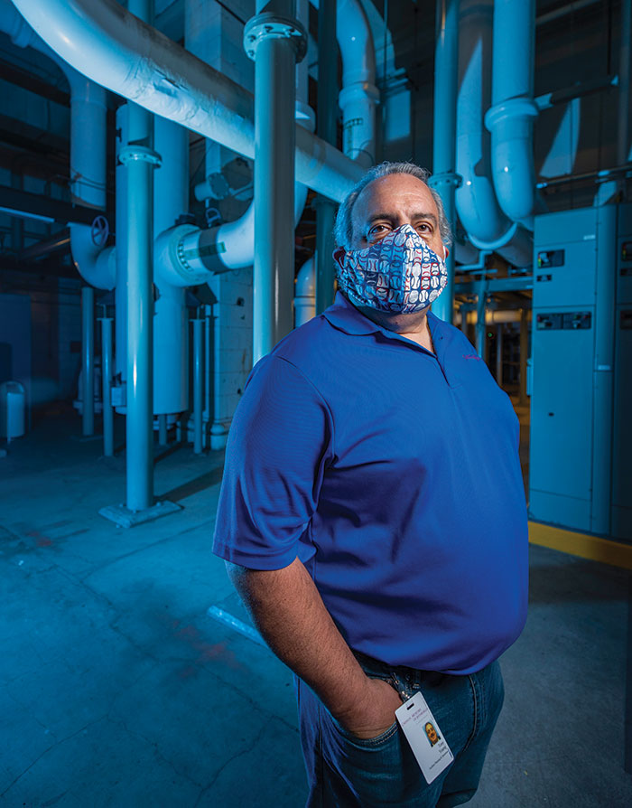 A portrait of Tony Young wearing a mask in the museum's chiller plant.