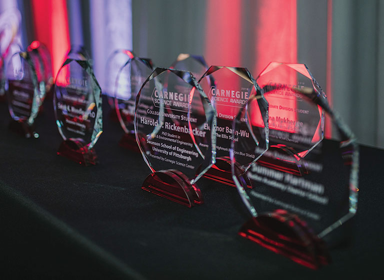 A series of awards on a table