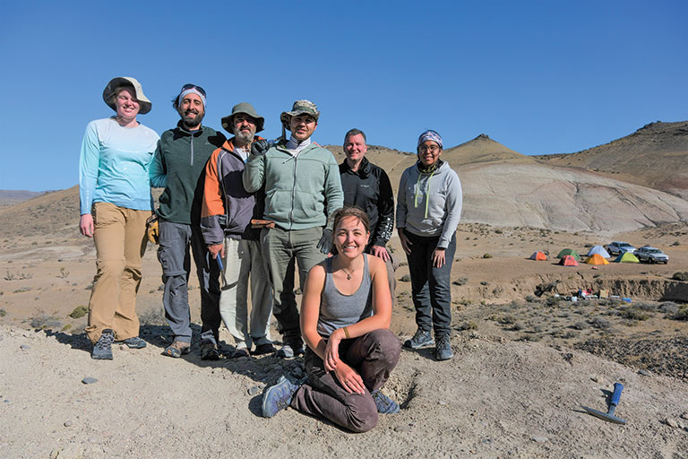A group of scientists and others posing for a photo on an expedition.