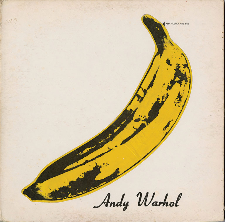 A cover of a record album that has a peelable yellow banana artwork by Andy Warhol on a white background. On the bottom right, hand corner, it says, “Andy Warhol” in black.