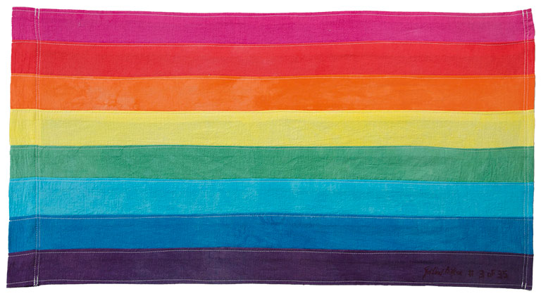 A flag with colors of the rainbow.