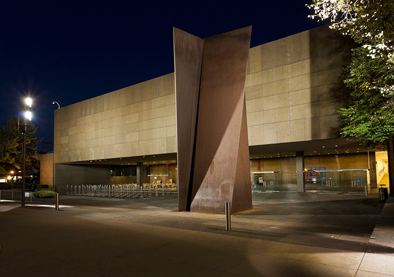 A photo of the exterior of Carnegie Museum of Art with a large metal sculpture in the foreground.