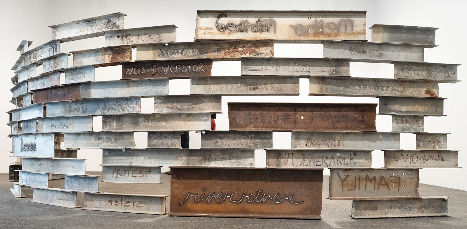 An installation view of artwork made of steel beams.
