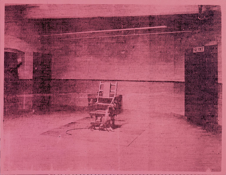 A image of an electric chair with a pink hue over the image.