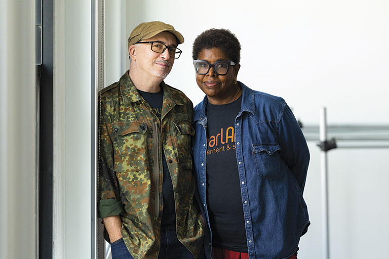 Two people standing together in casual clothing