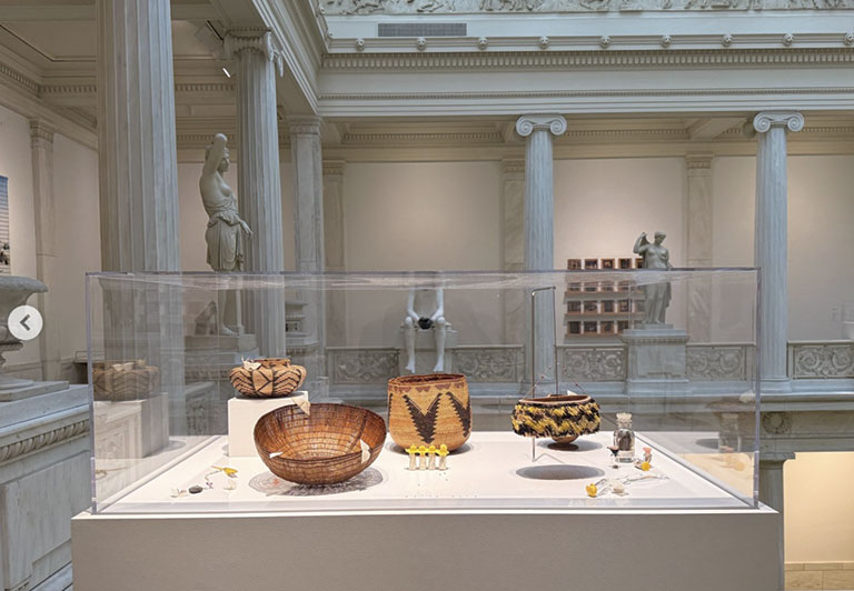 Traditional woven baskets on display in museum case