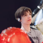 A young man with sound-control earphones taking part in a sensory-friendly event